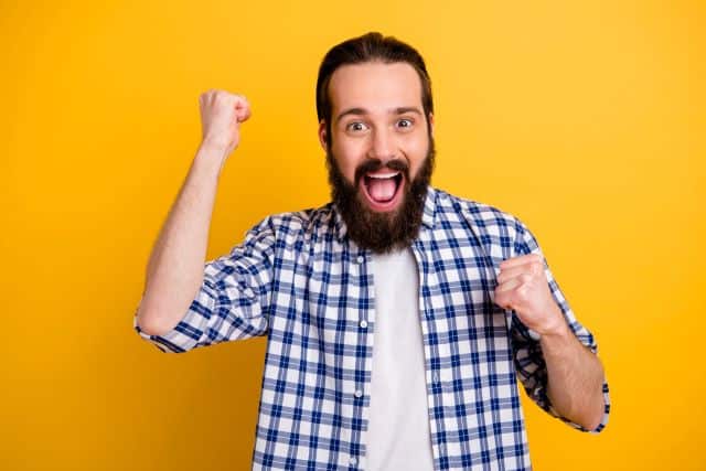 Happy man celebrating a lottery win